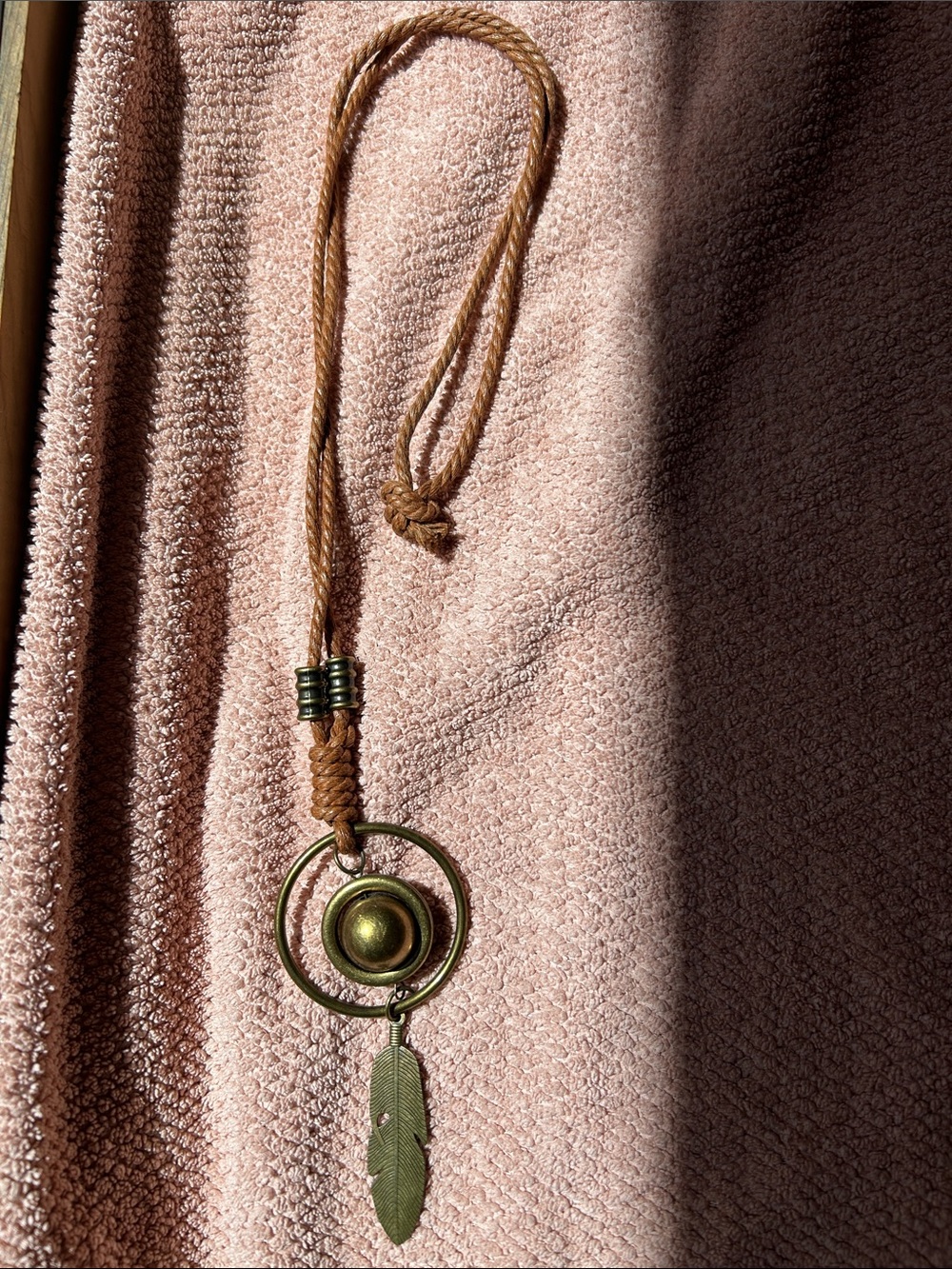 Bohemian Brass Circle & Feather Pendant Necklace in Brown